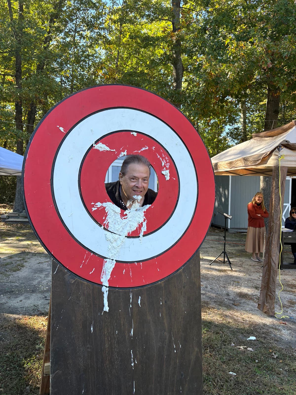 A good sport in the pie-throwing target at a fellowship day